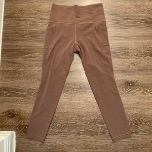 Athleta Stash pocket salutation 7/8 leggings